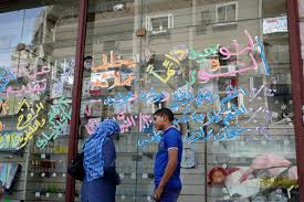 Store owner faces criminal charges for selling Egyptian flag shoes