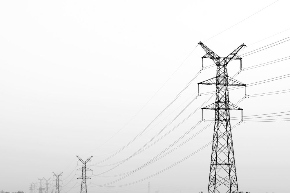 How will the government freeze on electricity prices for industries affect the renewable energy sector?