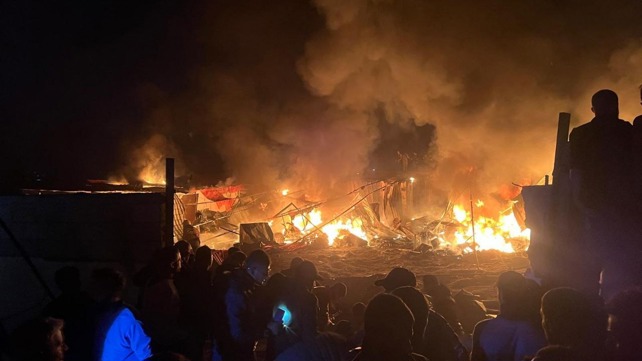 Eyewitnesses describe charred remains of children after Israeli shelling in Mawasi sets tent shelters ablaze